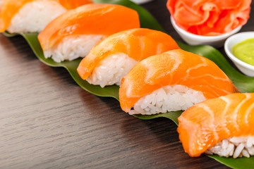 sushi with salmon on a leaf