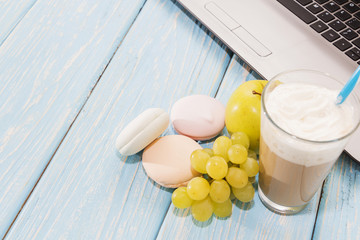 open notebook, white mug with coffee, marshmallows.