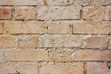 Brick Wall Pattern of Grunge Painted Rustic Brown Stone Background. Vintage Rough Stone Material Wall, Close Up Image. Interior Decor Detail, Weathered Old Brick Textured Wall with Empty Copy Space.