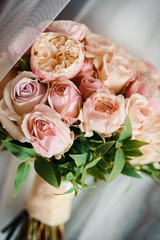 Stunning bridal bouquet. Wedding ceremony. Mix of peony, succulents, orchids and roses. Modern bridal accessories. Wedding flowers