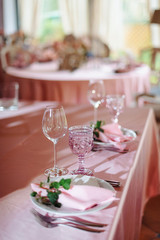Wedding tables set for banquet or wedding event catering. Party celebration wedding concept. Flowers wedding decoration of tables for guests of bride and groom. Table appointment event