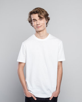 Portrait of friendly teenager in white t-shirt