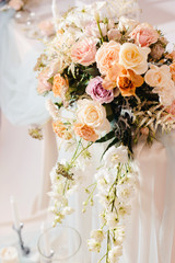 Wedding tables set for banquet or wedding event catering. Party celebration wedding concept. Flowers wedding decoration of tables for guests of bride and groom. Table appointment event