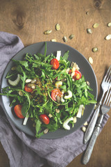 Green salad, arugula, cherry tomatoes, celery