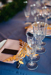 Wedding tables set for banquet or wedding event catering. Party celebration wedding concept. Flowers wedding decoration of tables for guests of bride and groom. Table appointment event