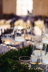 Wedding tables set for banquet or wedding event catering. Party celebration wedding concept. Flowers wedding decoration of tables for guests of bride and groom. Table appointment event