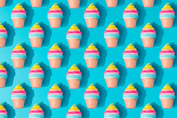 Colorful ice cream pattern on pastel blue background. Creative minimal summer flat lay.