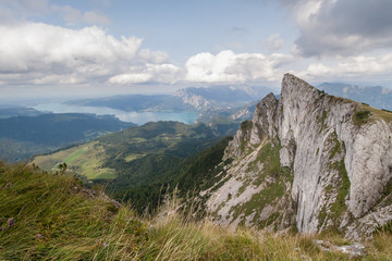 Fototapeta na wymiar Panoramic view of mountains from Schafberg peak in Salzkammergut, Austria in a beautiful summer day