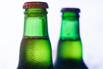 Ice Cold Green Beer Bottle On White Background Closeup