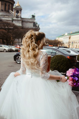Silhouette of beautiful bride weared in dress and veil. Wedding dress and happiness. Love and new family concept. Honeymoon. Park or interior. Saint-Petersburg wedding tourism. Russian bride