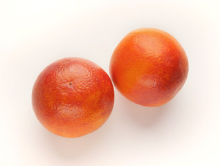 Whole bloody oranges isolated on white background