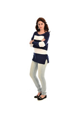 Fototapeta premium full length portrait of girl wearing striped blue and white jumper and jeans. standing pose on white studio background