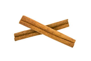 two cinnamon sticks on a white background