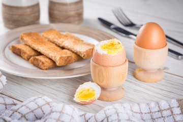 Breakfast time with boiled eggs on toast