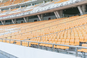 Naklejka premium Sport stadium Plastic chairs in a row