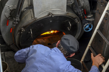 fireman, stoker or boilerman . Powering a steam engine ship