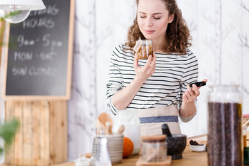 Woman holding a skincare product
