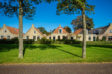 Old and gorgeous houses are scattered along the main street of the village of Schiermonnikoog on the Dutch Wadden Isle of the same name. Photo is shot in September.