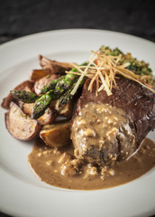 Filet mignon with blue cheese gravy, roasted potatos and asparagus