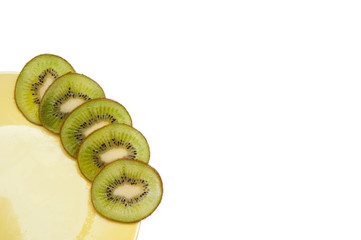 sweet ripe kiwi fruits on white, Kiwi cut into slices lay on a yellow plate, serving fruit