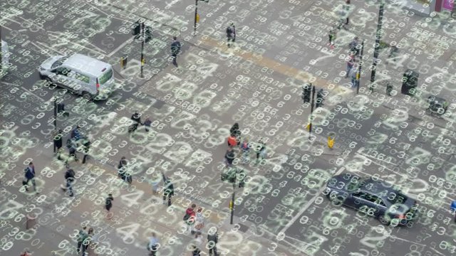 Urban street crossing with electronic numbers.