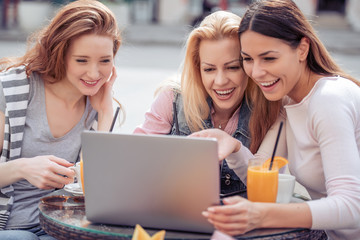 Group of friends having a coffee together