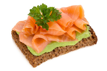 Bread with fresh salmon fillet isolated on white background, top view.
