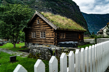 old wood house with grass roof