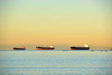 Oil Tankers docked at Port of Vancouver at sunrise in Vancouver, British Columbia, Canada. © Wangkun Jia