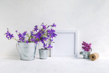 Mockup with a white frame and summer flowers