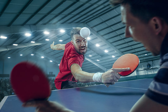 The table tennis player serving