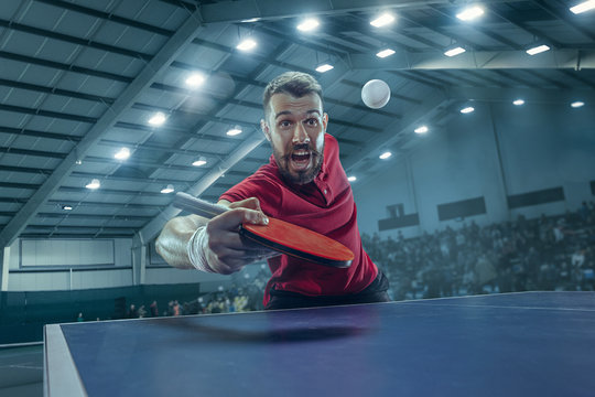 The table tennis player serving