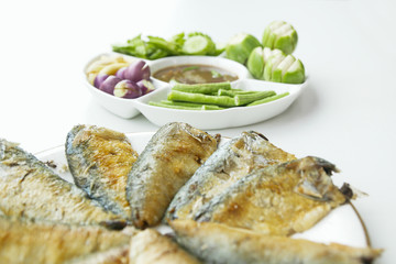 Shrimp paste sauce (Nam Prik Ka Pi) serve with vegetables and mackerel fish, Thai Food, isolate on white background