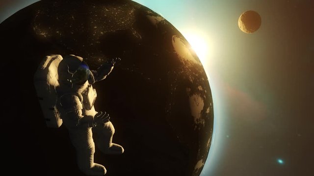 Astronaut in outer space against the backdrop of the planet earth. 