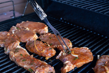 grilled meat skewers, barbecue. Raw meat. Grilled beef steak. meat is on grill with smoke. Selective focus. Copy space