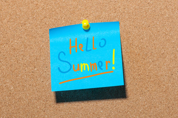 Hello Summer - text on little blue paper pinned to cork board background