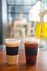 Cup of iced black coffee americano and iced coffee latte
