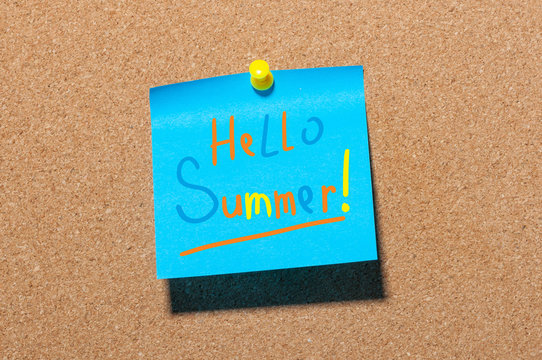 Hello Summer - text on little blue paper pinned to cork board background