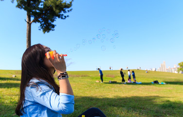 asian young woman making bubble