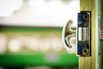Close-up view of the old door passenger train and door handle.