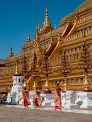 Monks in Shwezigon Paya in Bagan area