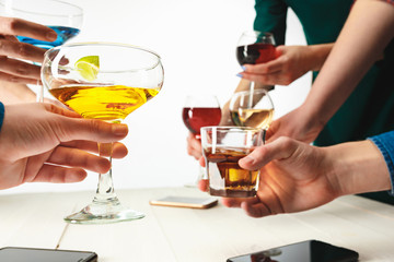 The male and female hands with exotic cocktails