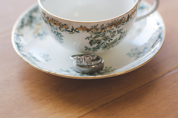 wedding ring on a teacup
