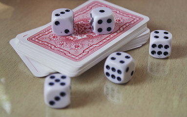 Dice, coins and playing cards. Casino, a popular source of randomness in board games. Entertainment, gambling.