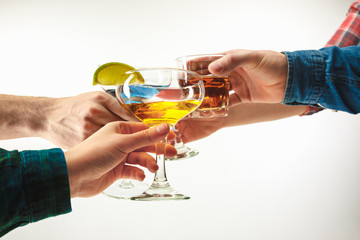 The male and female hands with exotic cocktails