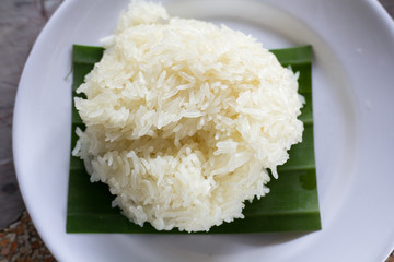 Rice, Sticky Rice on leaf of banana and dish white.