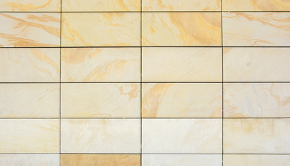 Wall of yellow granite tiles