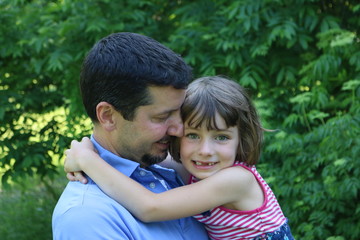 Fototapeta premium Father holding his young daughter