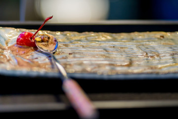 The last cherry on an ice cream dish for the best eat.