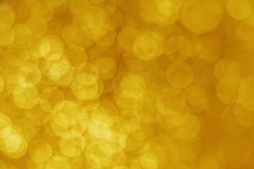 abstract yellow bokeh glitter sparkle background.